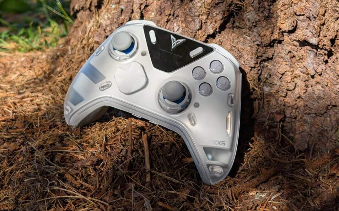 Flydigi Apex 5 next to a tree