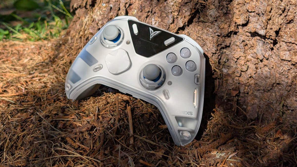 Flydigi Apex 5 next to a tree