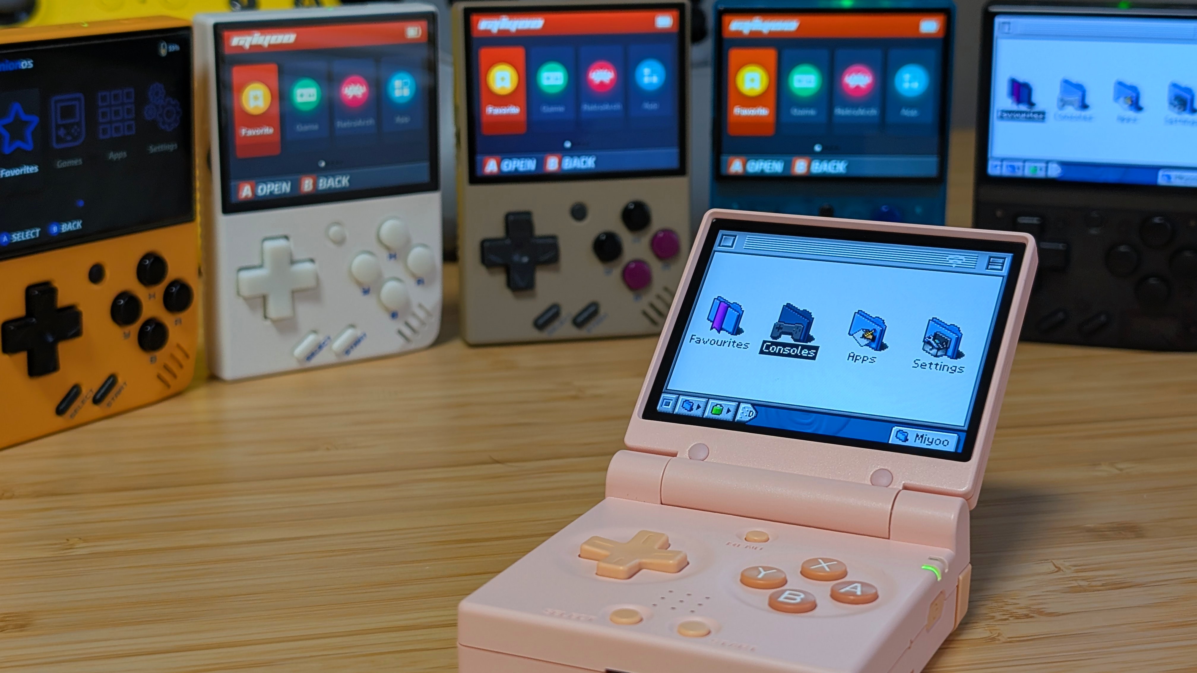 Miyoo Mini Flip Surrounded by Miyoo Mini's