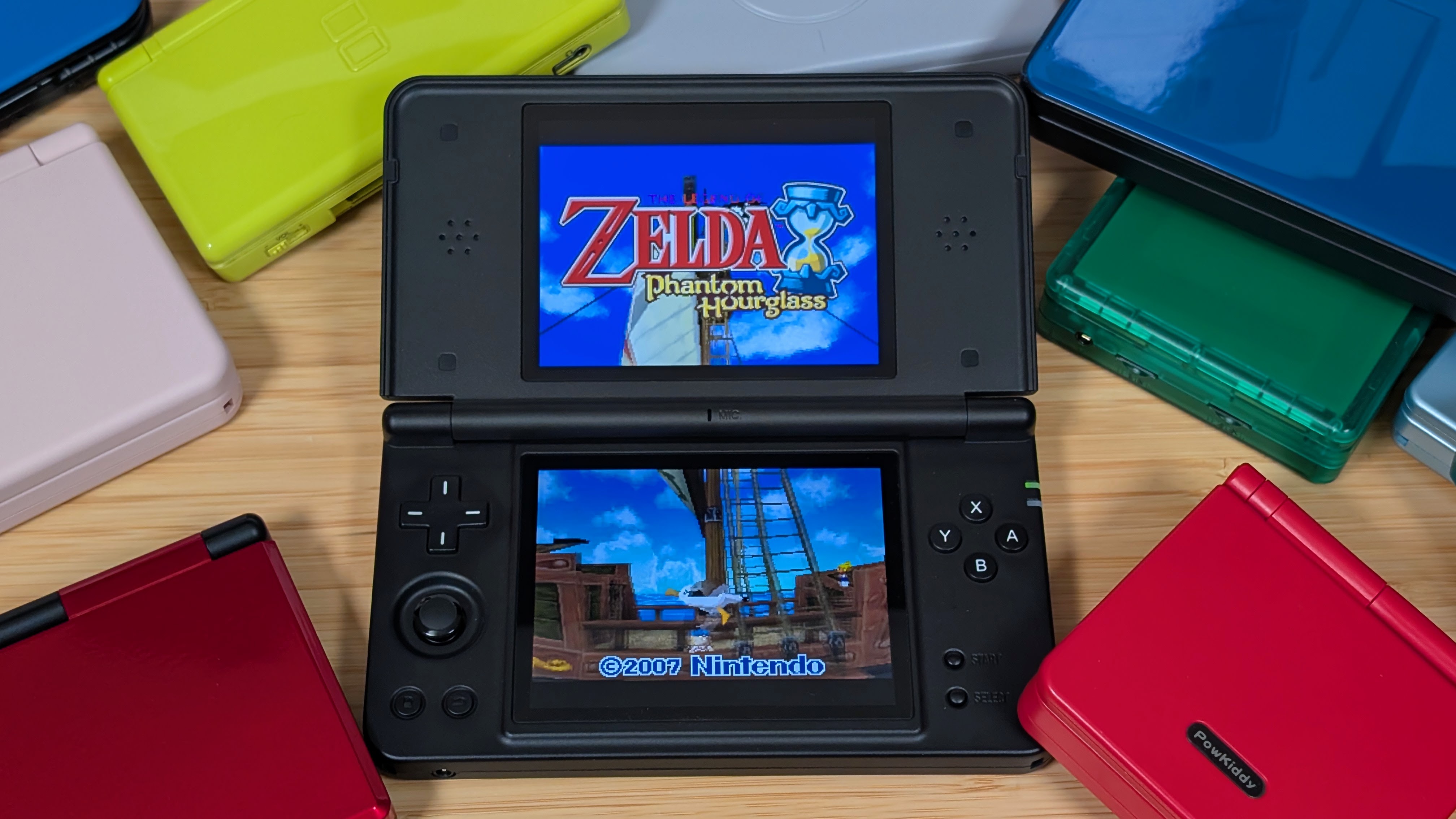 RG DS Plus Surrounded by Clamshells | Retro Handhelds RG DS Plus Surrounded by Clamshells
